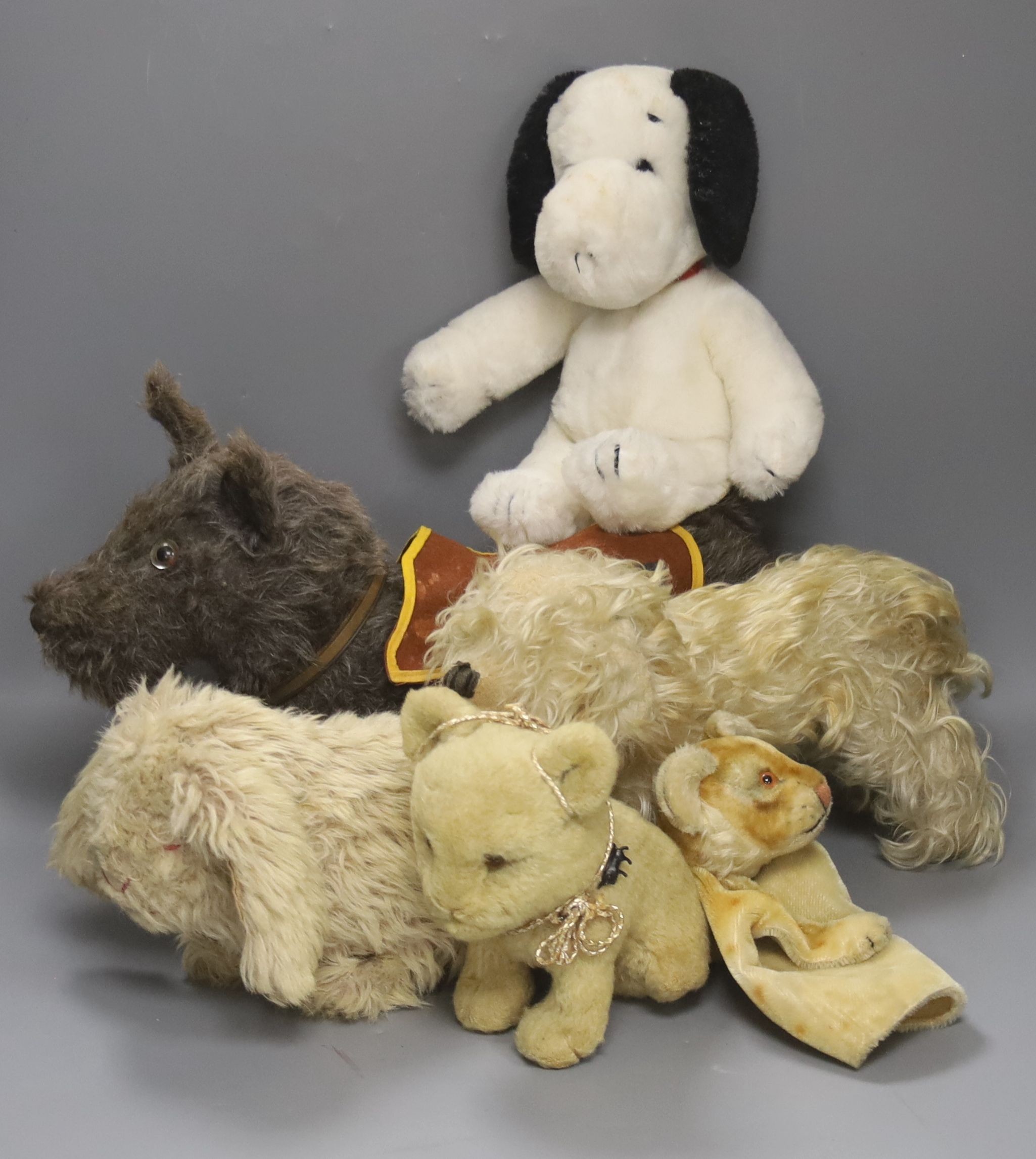 A collection of five various soft toy animals